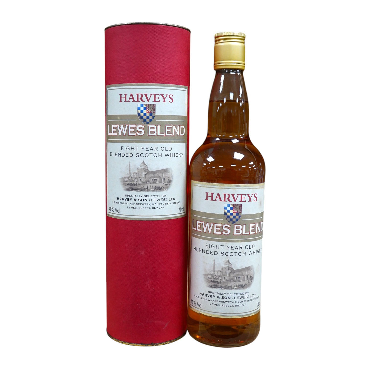 A bottle of Harveys Lewes Blend eight-year old whisky with case. Condition - good